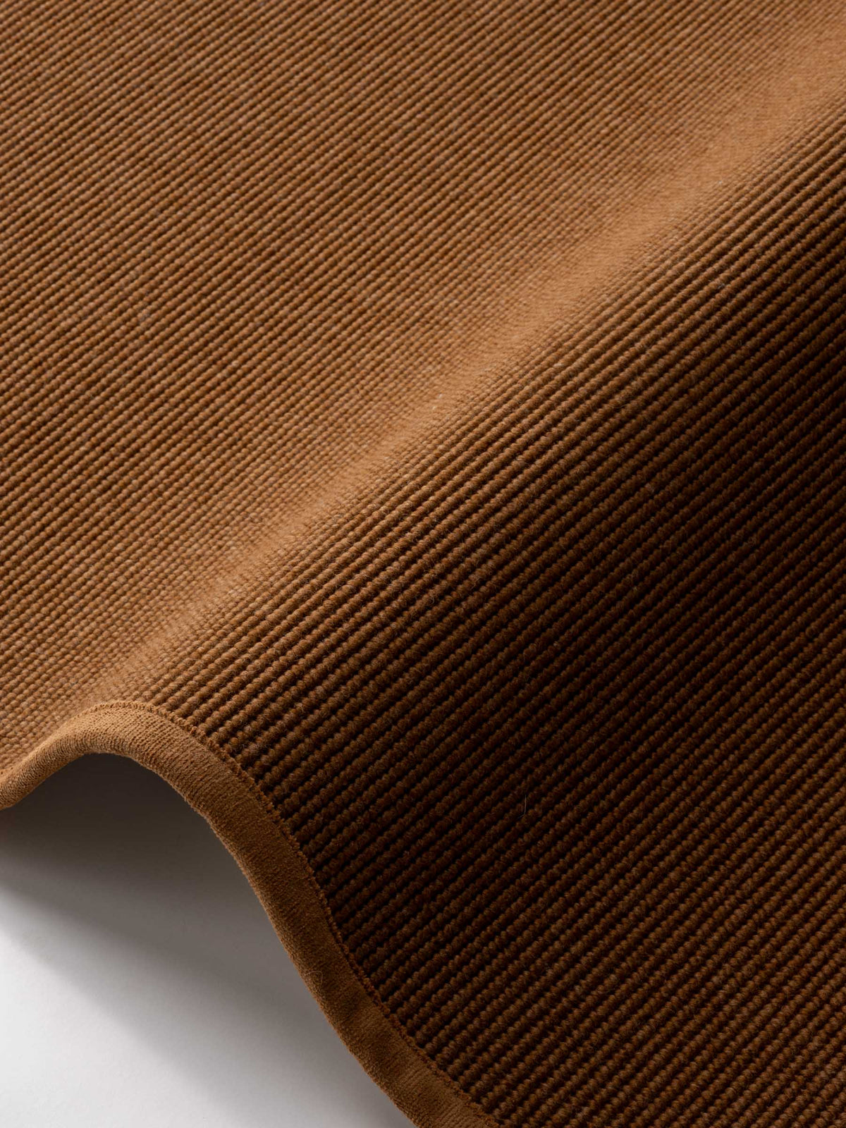 Sarea wool rug in Earth Copper – NORUM